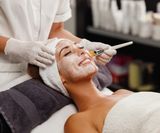 shot-beautiful-young-woman-getting-facial-mask-treatment-beauty-salon